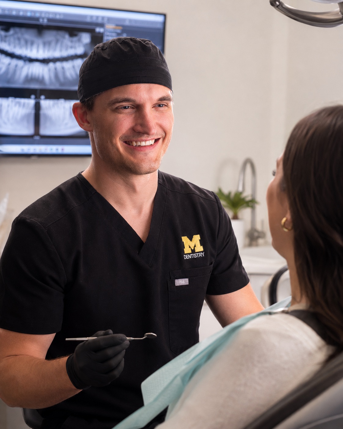 Dr. Jon Misch chairside with a patient at Pinckney Implants & Periodontics